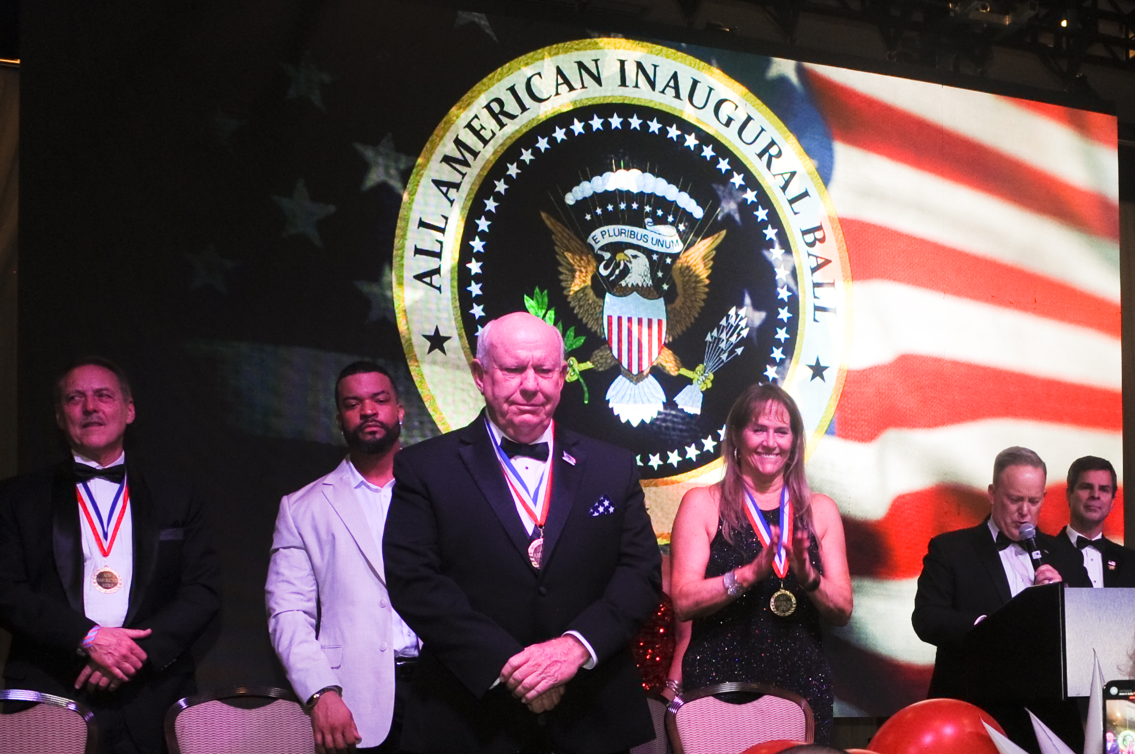 Medal recipients on stage at the 2025 Ball