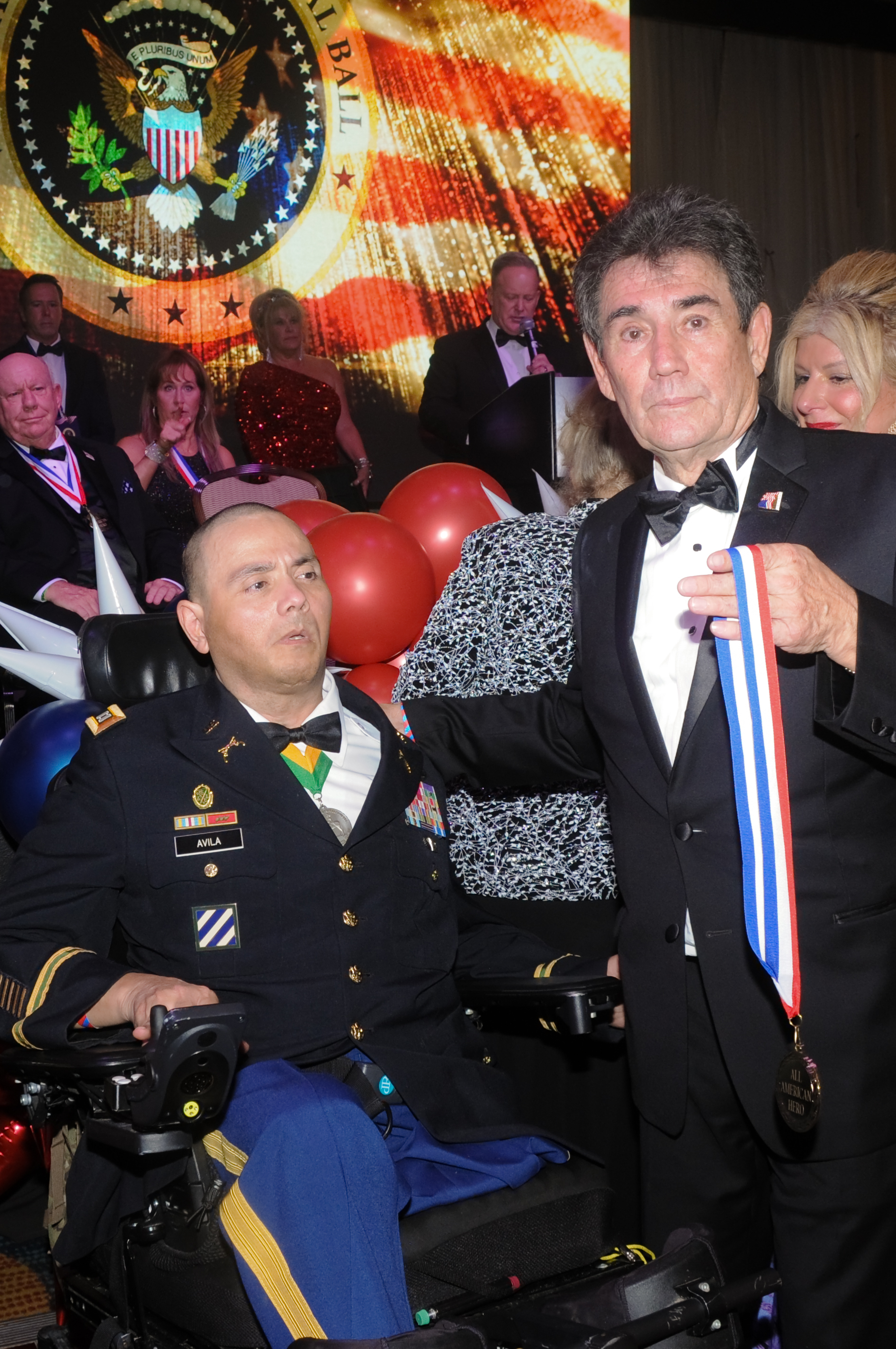 Decorated soldier receiving All-American Hero award