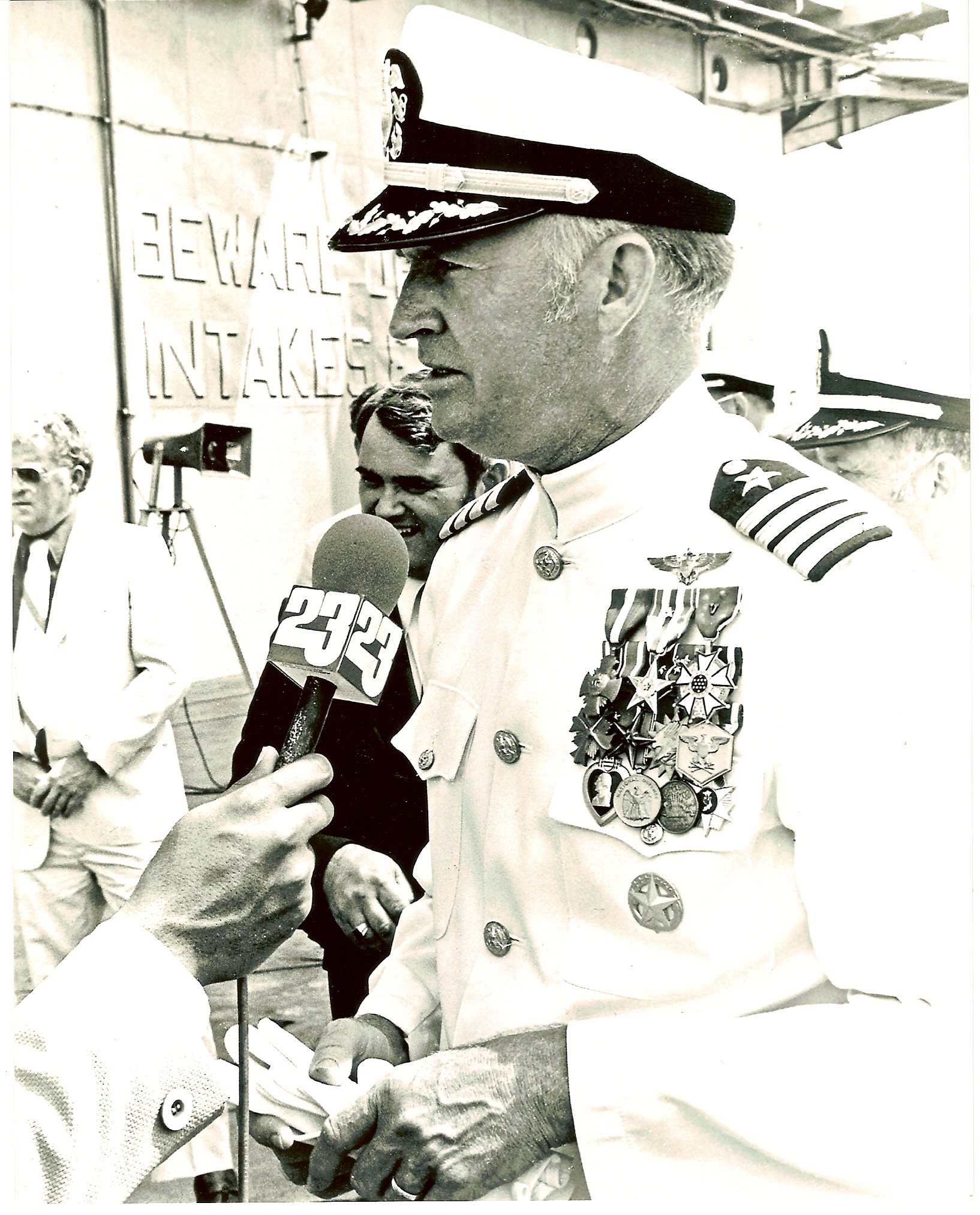 Captain Red McDaniel in Navy dress whites with full medals during his post-release Navy command